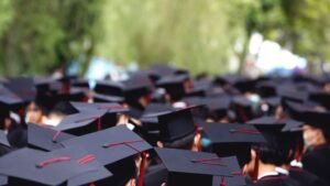 students wearing black graduation caps