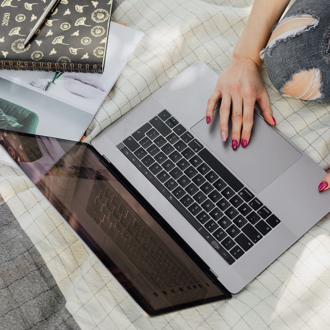 a young woman doing research on a laptop